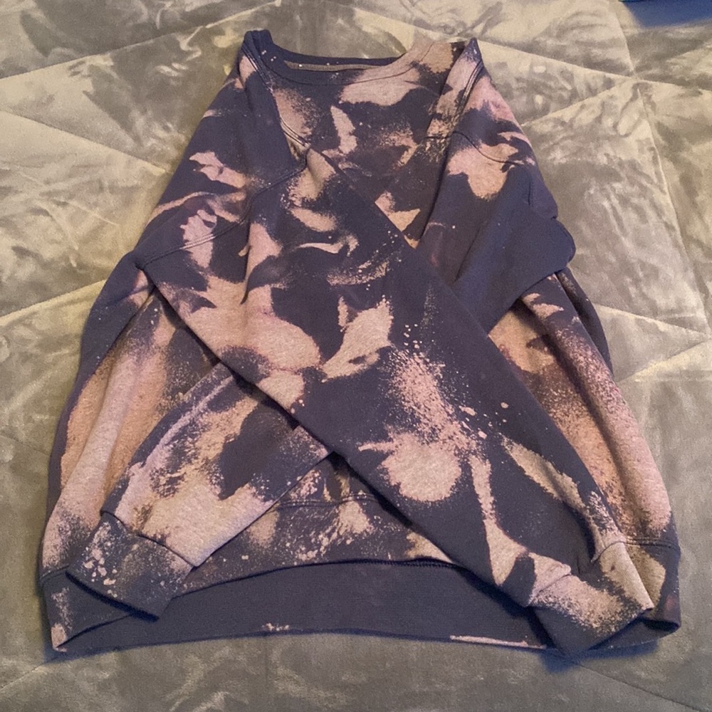 A bleach dyed navy blue crewneck